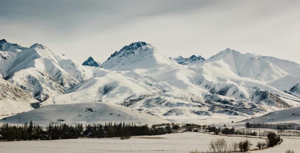 Tranquil winter landscape of snowy mountains in Ak-Talaa, Kyrgyzstan.